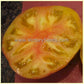 A slice of a 'Dwarf Confetti' tomato. Photo by Craig LeHoullier.