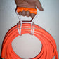 A great way to keep long cords and hoses neat. Use to both hang and carry.